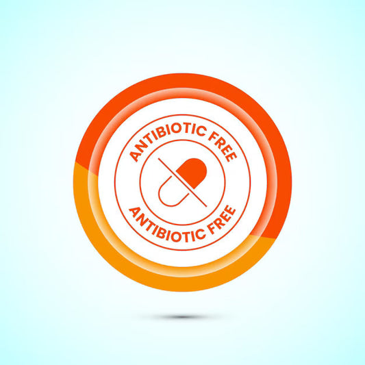 This is an image with a circular symbol and a drug capsule in the centre with a strike through it.  The caption above and below the capsule says Antibiotic Free